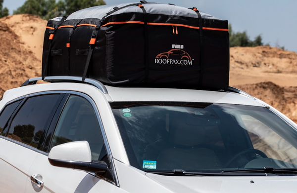 How do you pack and organize things on a roof box for camping?